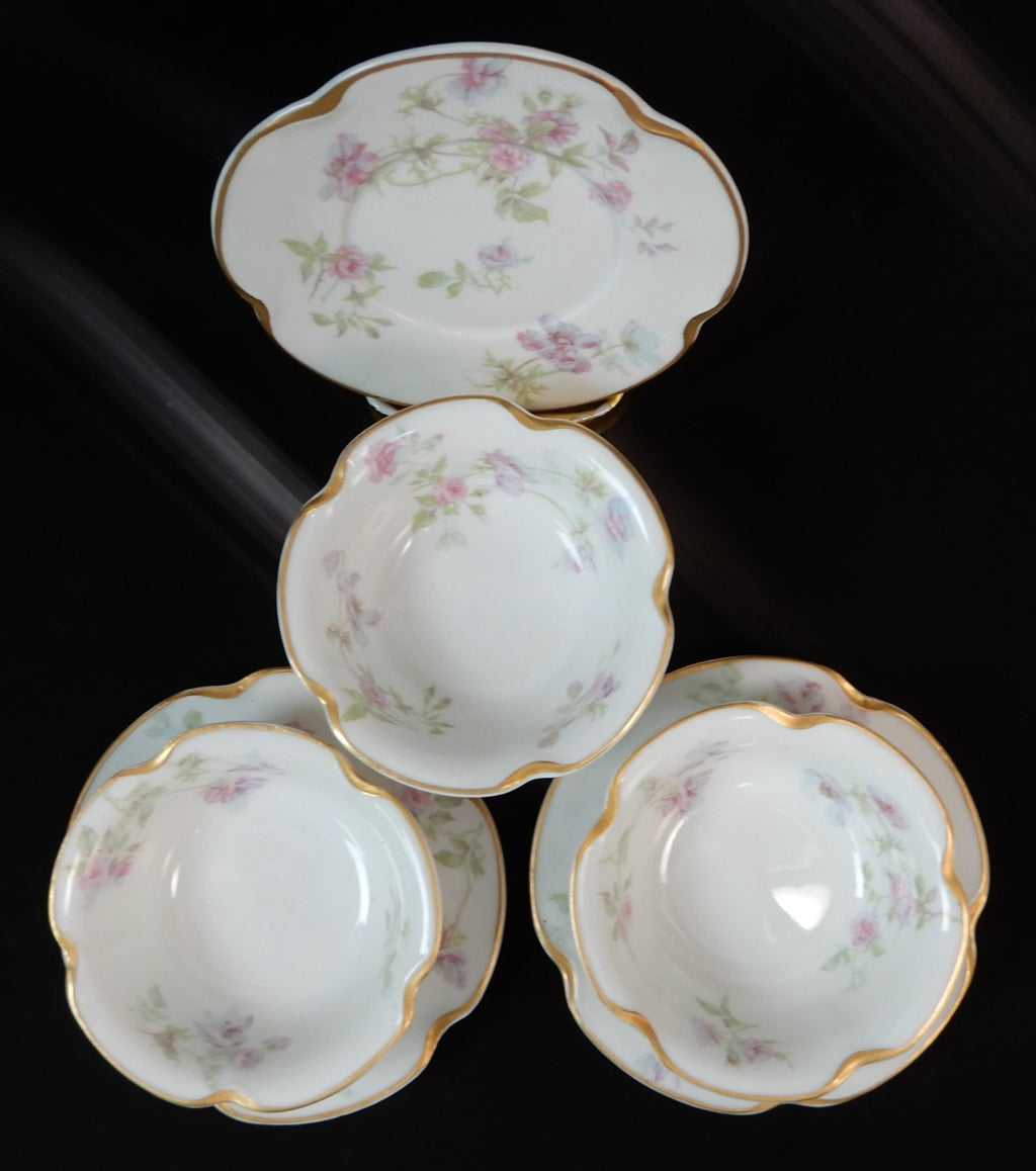 Set of three Haviland Limoges Floral Ramikins and Saucers