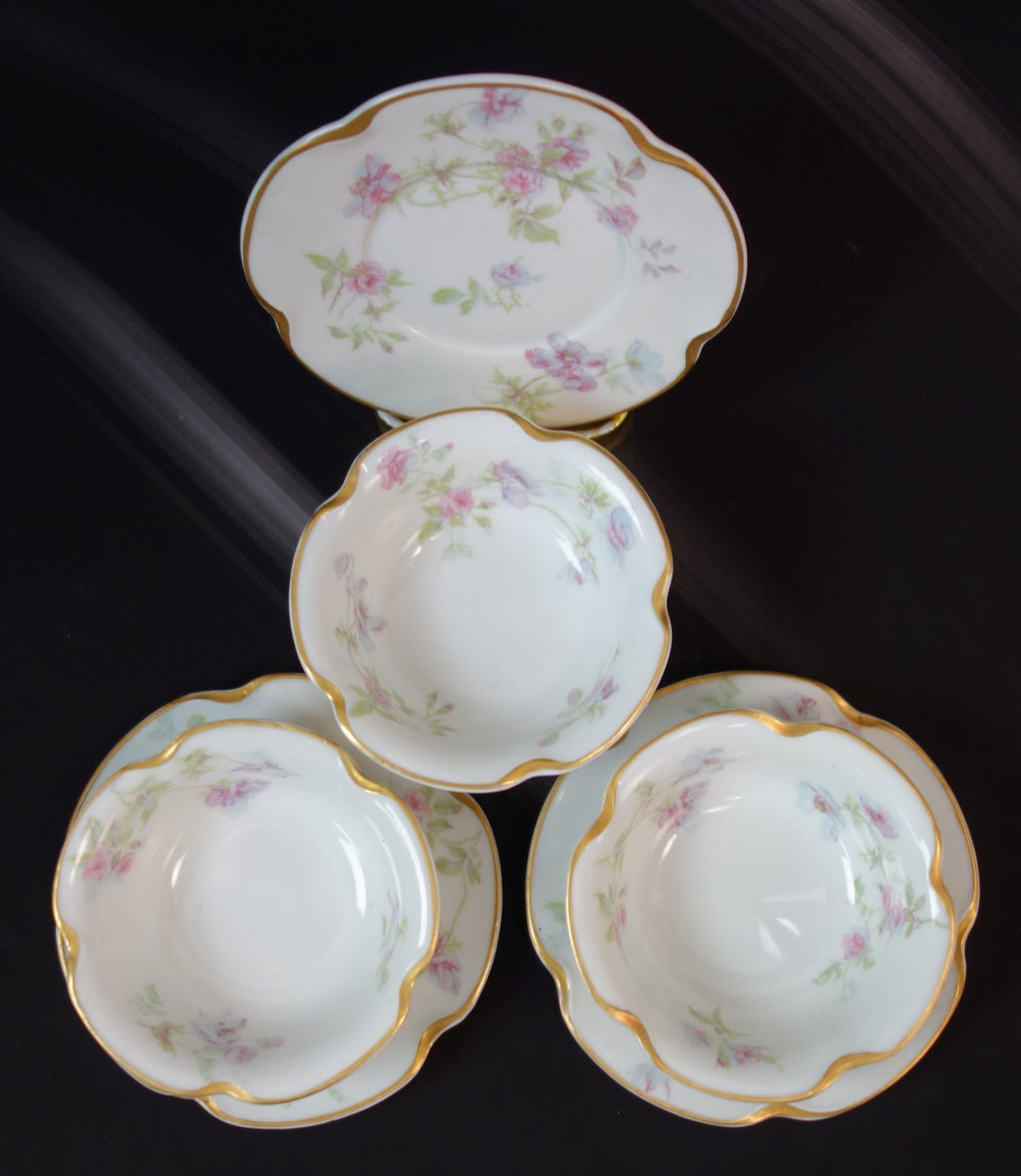 Set of three Haviland Limoges Floral Ramikins and Saucers
