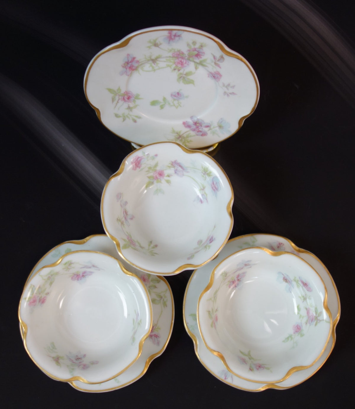 Set of three Haviland Limoges Floral Ramikins and Saucers